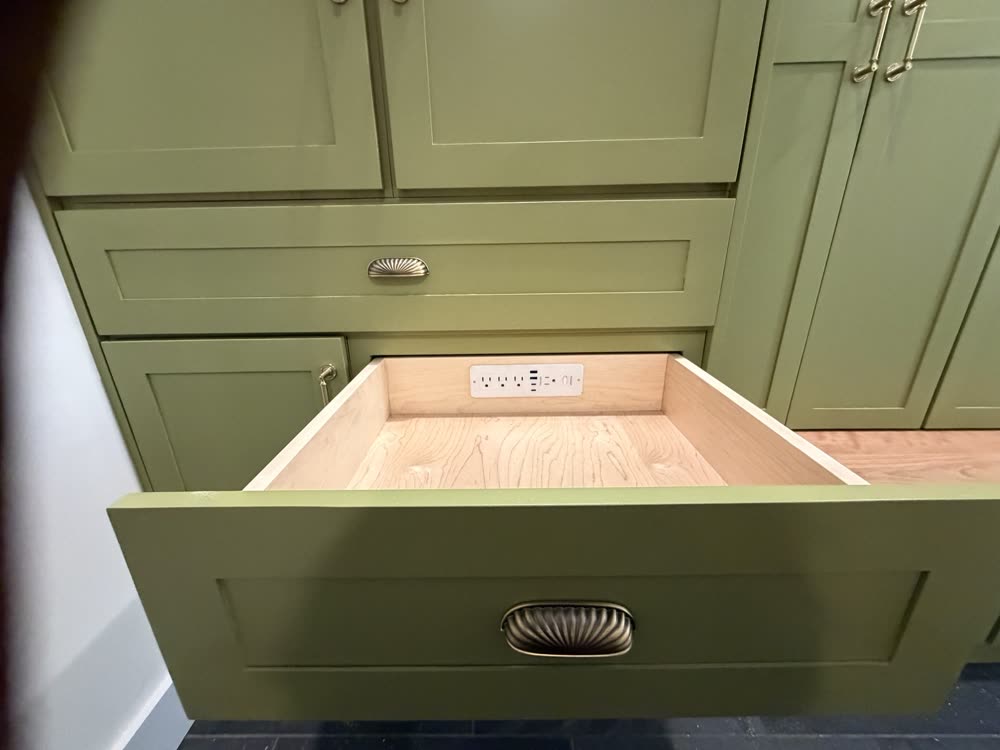 Drawer with a built-in charging outlet