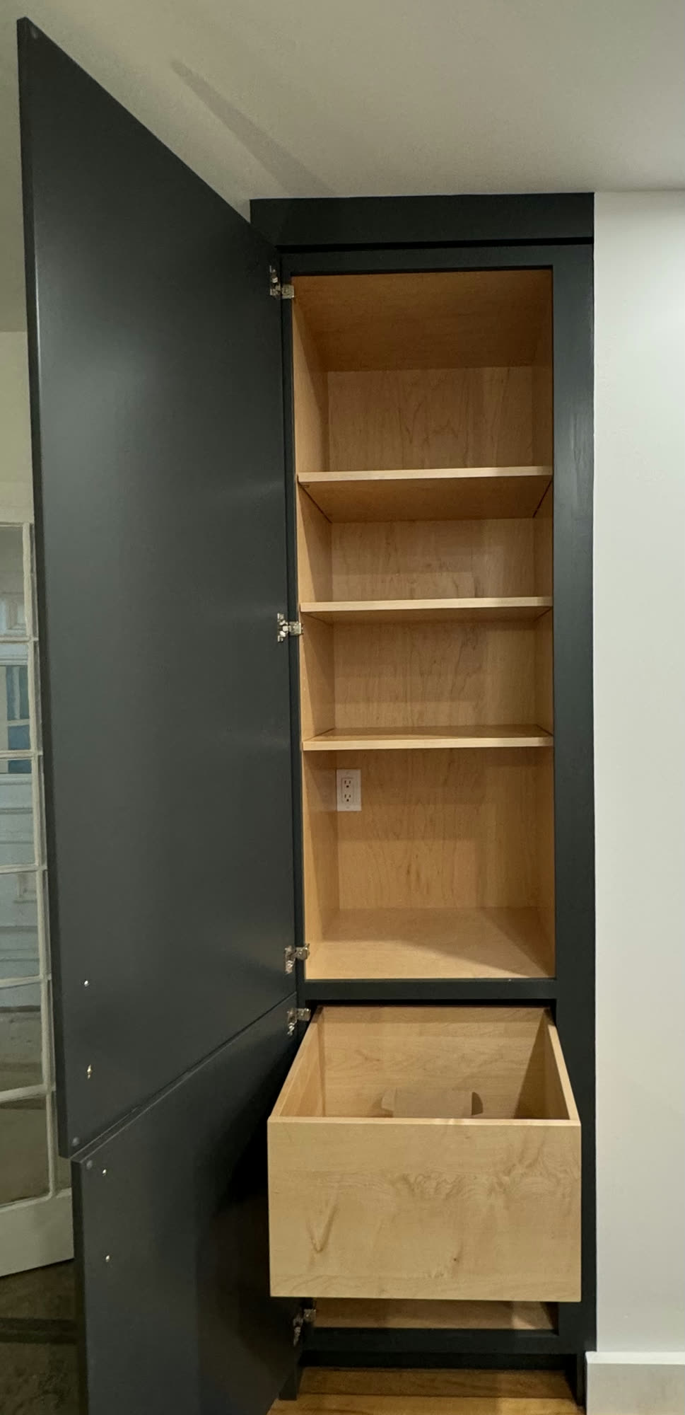 Dark pantry cabinet with maple interior