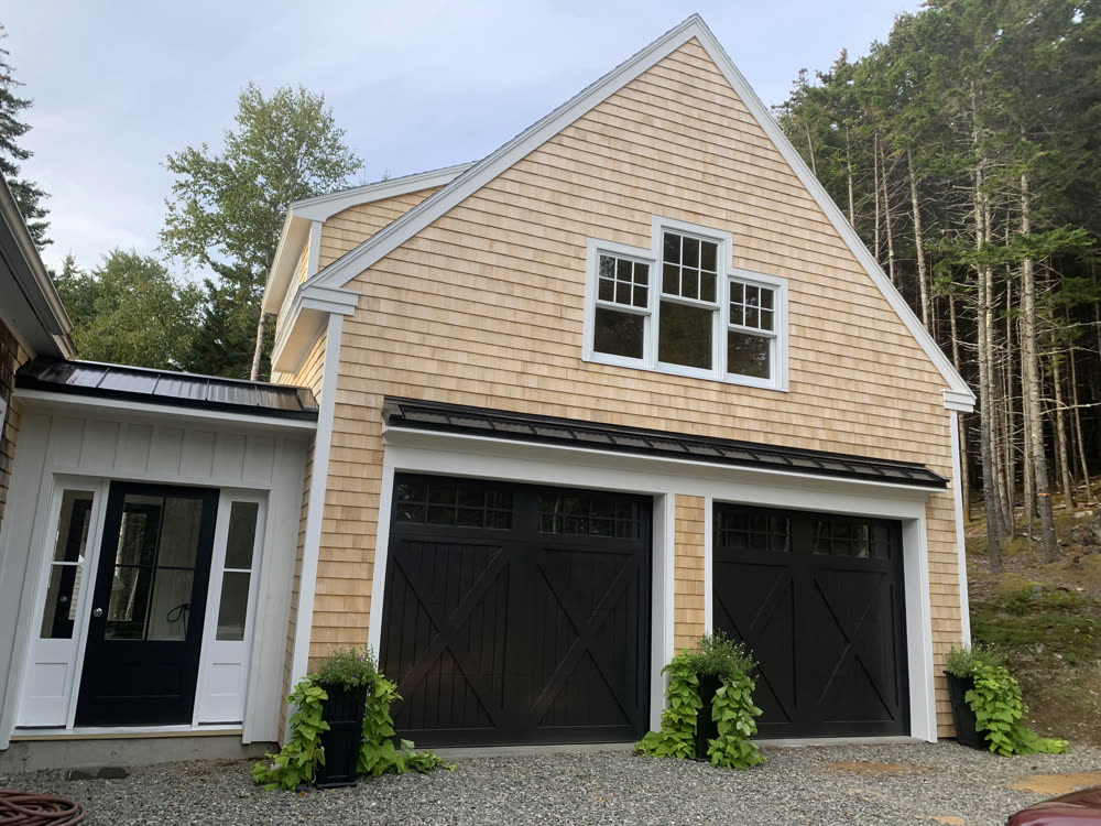 Shingle-style garage with carriage doors