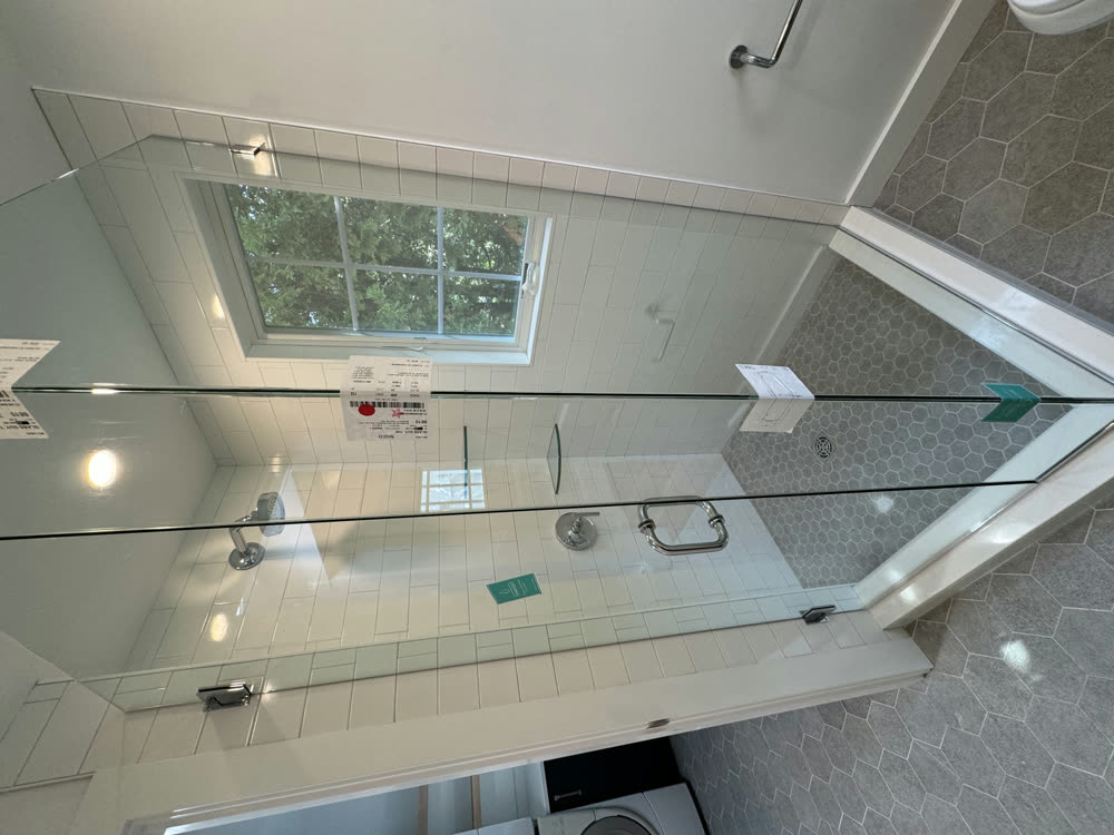 Glass shower enclosure